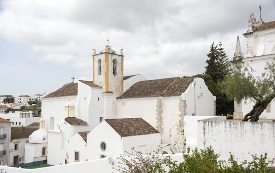 Old houses and churchn in the algarve area of Portugal