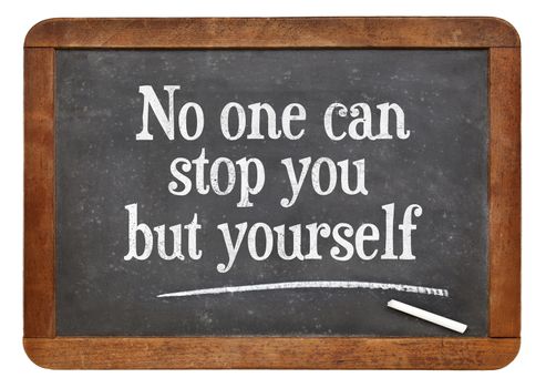 No one can stop you but yourself. Motivational text on a vintage slate blackboard