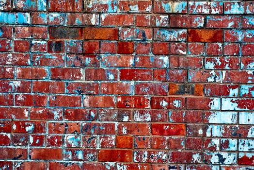 The grunge olden colored brick wall texture