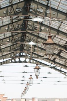 roof of railway station with old-fashioned lanterns