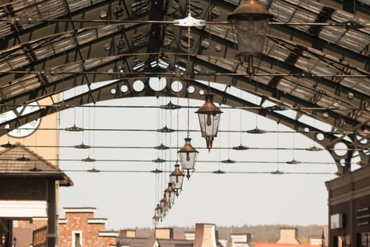roof of railway station with old-fashioned lanterns