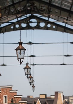 roof of railway station with old-fashioned lanterns