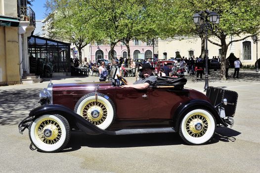 old car photographed at the rally of vintage cars Town Hall Square in the town of Ales, in the Gard department