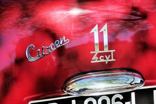 Citroen front-wheel Drive red photographed at the rally of vintage cars Town Hall Square in the town of Ales, in the Gard department