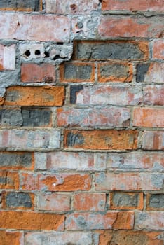 The grunge olden colored brick wall texture