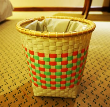 Empty trash bin on floor of bedroom for the dry waste.         