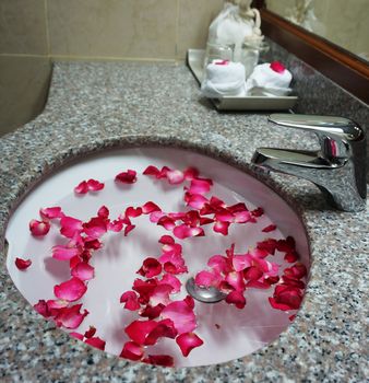 Hotel bathroom sink and faucet provided to celebrate for wedding couple.                           