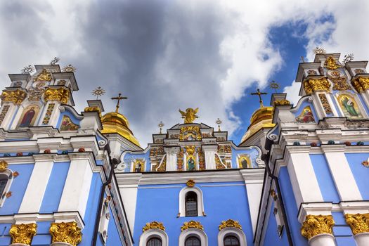 Saint Michael Monastery Cathedral Steeples Spires Facade Kiev Ukraine.  Saint Michael's is a functioning Greek Orthordox Monasatery in Kiev.  The original monastery was created in the 1100s but was destroyed by the Soviet Union in the 1930s.  St. Michaels was reconstructed after Ukrainian independencein 1991 and reopened in 1999.