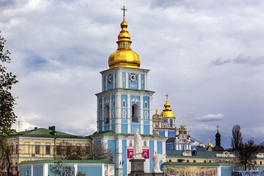 Saint Michael Monastery Cathedral Steeples Spires Tower Golden Dome Facade Kiev Ukraine.  Saint Michael's is a functioning Greek Orthordox Monasatery in Kiev.  The original monastery was created in the 1100s but was destroyed by the Soviet Union in the 1930s.  St. Michaels was reconstructed after Ukrainian independencein 1991 and reopened in 1999.