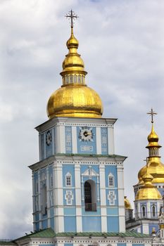 Saint Michael Monastery Cathedral Steeples Spires Golden Domes Kiev Ukraine.  Saint Michael's is a functioning Greek Orthordox Monasatery in Kiev.  The original monastery was created in the 1100s but was destroyed by the Soviet Union in the 1930s.  St. Michaels was reconstructed after Ukrainian independencein 1991 and reopened in 1999.