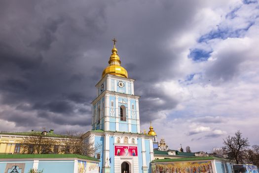 Saint Michael Monastery Cathedral Steeples Spires Tower Golden Dome Facade Kiev Ukraine.  Saint Michael's is a functioning Greek Orthordox Monasatery in Kiev.  The original monastery was created in the 1100s but was destroyed by the Soviet Union in the 1930s.  St. Michaels was reconstructed after Ukrainian independencein 1991 and reopened in 1999.