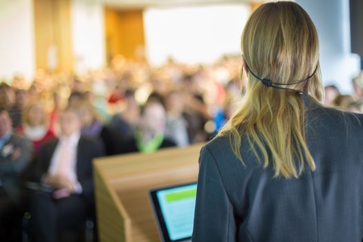 Female speaker at Business Conference and Presentation. Audience at the conference hall. Business and Entrepreneurship. Business woman.