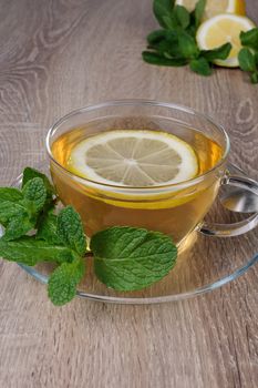 Cup of tea with a slice of lemon and  mint  