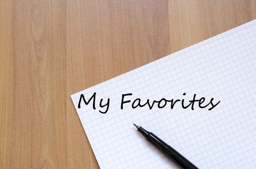 White blank notepad on office wooden table My favorites concept