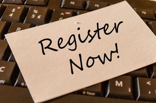 Register Now Concept on black keyboard