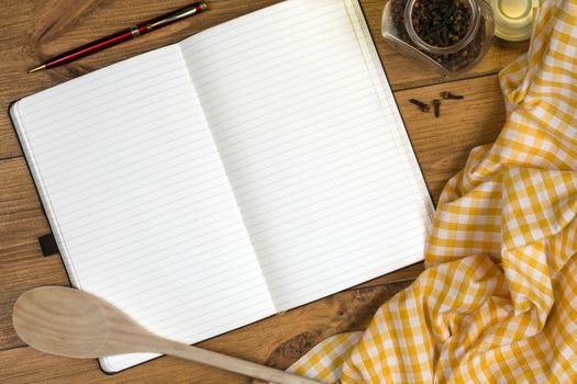 A Cooks Notebook on a farmhouse kitchen table - Space for Text