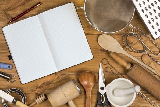 A selection of Kitchen Utensils on a farmhouse kitchen table - with Space for Text