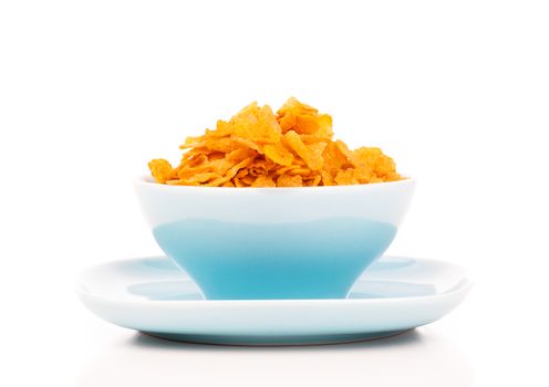 Cornflakes in porcelain bowl isolated on white background