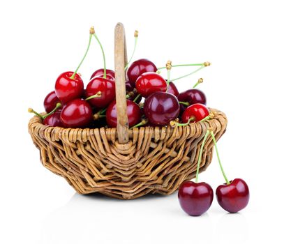 Basket full of fresh red cherry on a white background