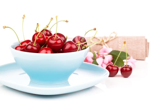 Bowl full of cherries isolated on white background