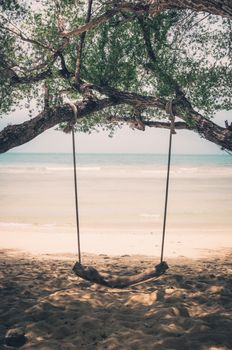 swing on beach sand and sea in Koh Samet Thailand vintage