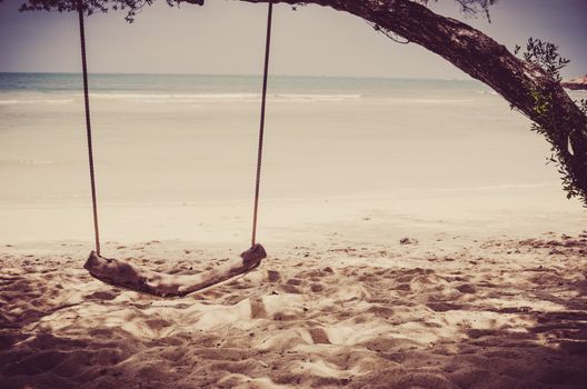 swing on beach sand and sea in Koh Samet Thailand vintage