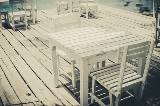 Wood dock White chair and table in Koh Samet Thailand vintage
