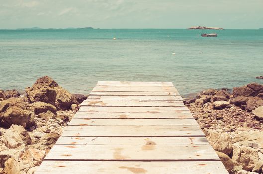 dock rock and blue sea in Thailand vintage