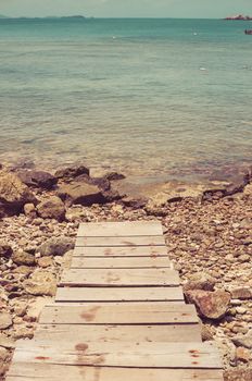 dock rock and blue sea in Thailand vintage