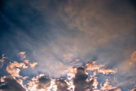 The soft white clouds against blue sky