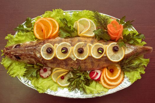 zander fish baked with greens fruits and vegetables