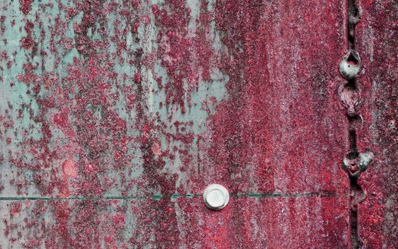 scratched and rusty red metal surface as background