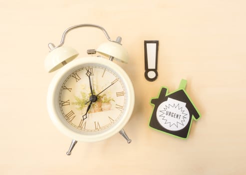 White Clock with Alert and Urgent Sign