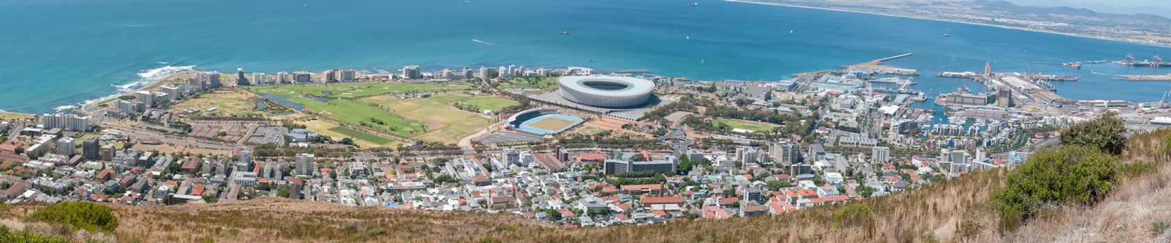 CAPE TOWN, SOUTH AFRICA - DECEMBER 18, 2014: Panorama of Sea Point, the Cape Town Stadium at Green Point, waterfront and harbor as seen from Signal Hill in Cape Town