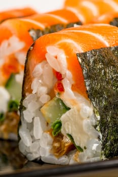 Vertical Photo - delicious rolls with salmon close-up