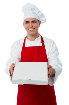 A chef in red uniform offering you a pizza box