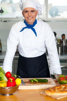 Portrait of a confident young male chef posing