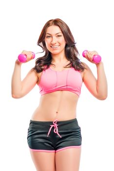 portrait of a beautiful trainer with dumbbells on a white background