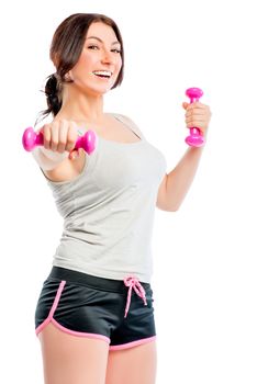 happy girl with dumbbells, studio shot