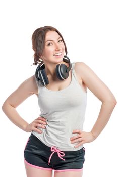 happy woman athlete with headphones on white background