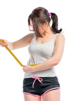 Girl measuring waist centimeters on a white background