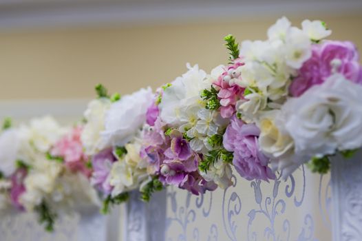 Wedding flowers decoration in the restaurant with white flowers.