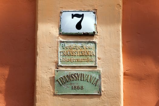 Sighisoara, Romania - June 23, 2013: Metal sign plates from an old house in Sighisoara, Transylvania, Romania