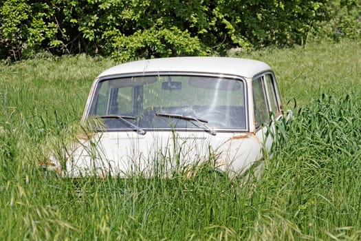 abandoned old car in yard