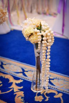 beautiful wedding vase with flowers on table