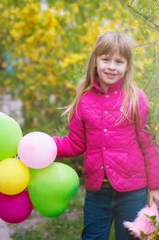 Smiling girl with a balloons. outdoor shoot