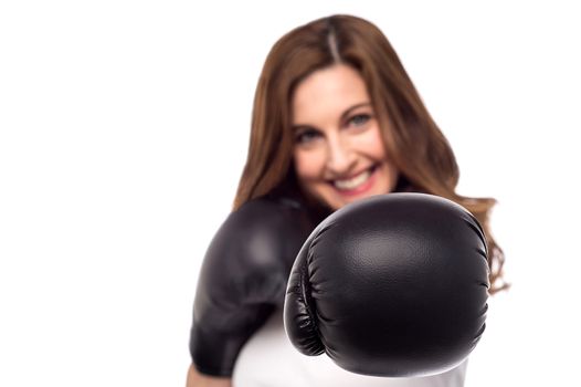 Young woman with boxing gloves, focus on gloves