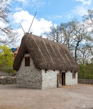 Traditional old Viking Age house hut in a village