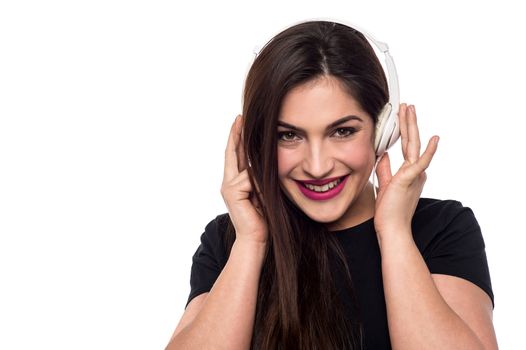 Young woman enjoying music in headphones