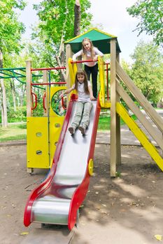 Photo of two active girls on nursery platform